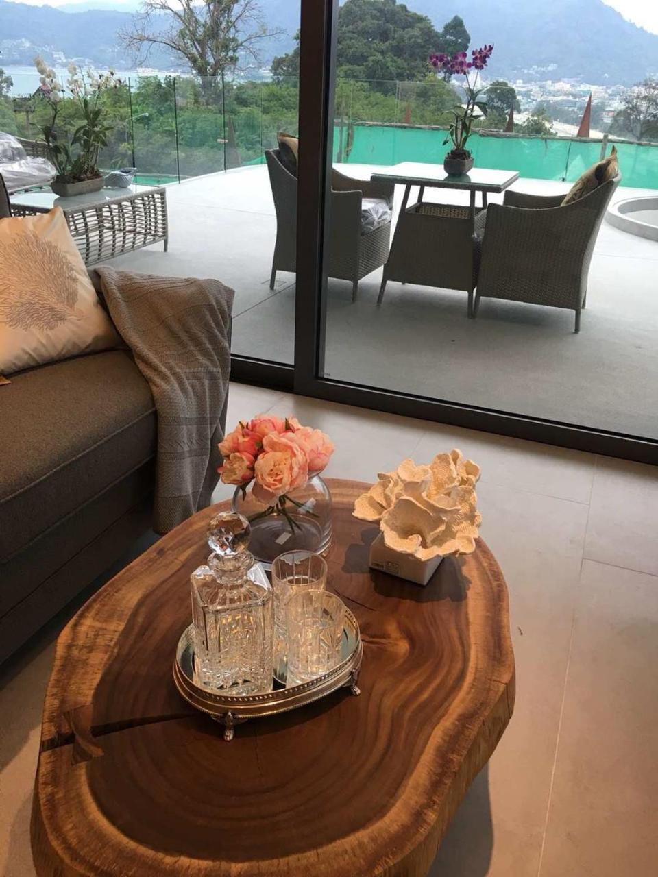 Patong Heights Hotel Exterior photo A table with a flower vase