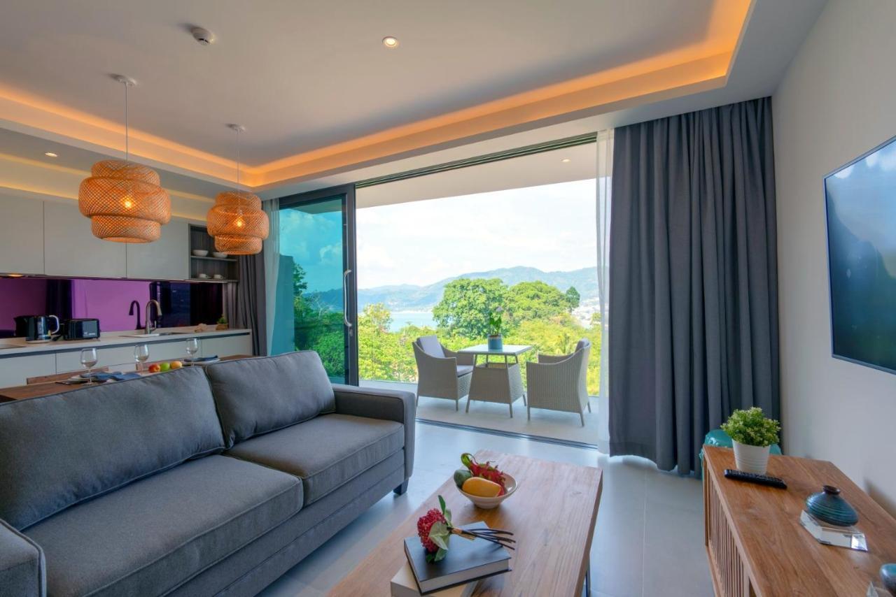 Patong Heights Hotel Exterior photo A living room with a view of the sea