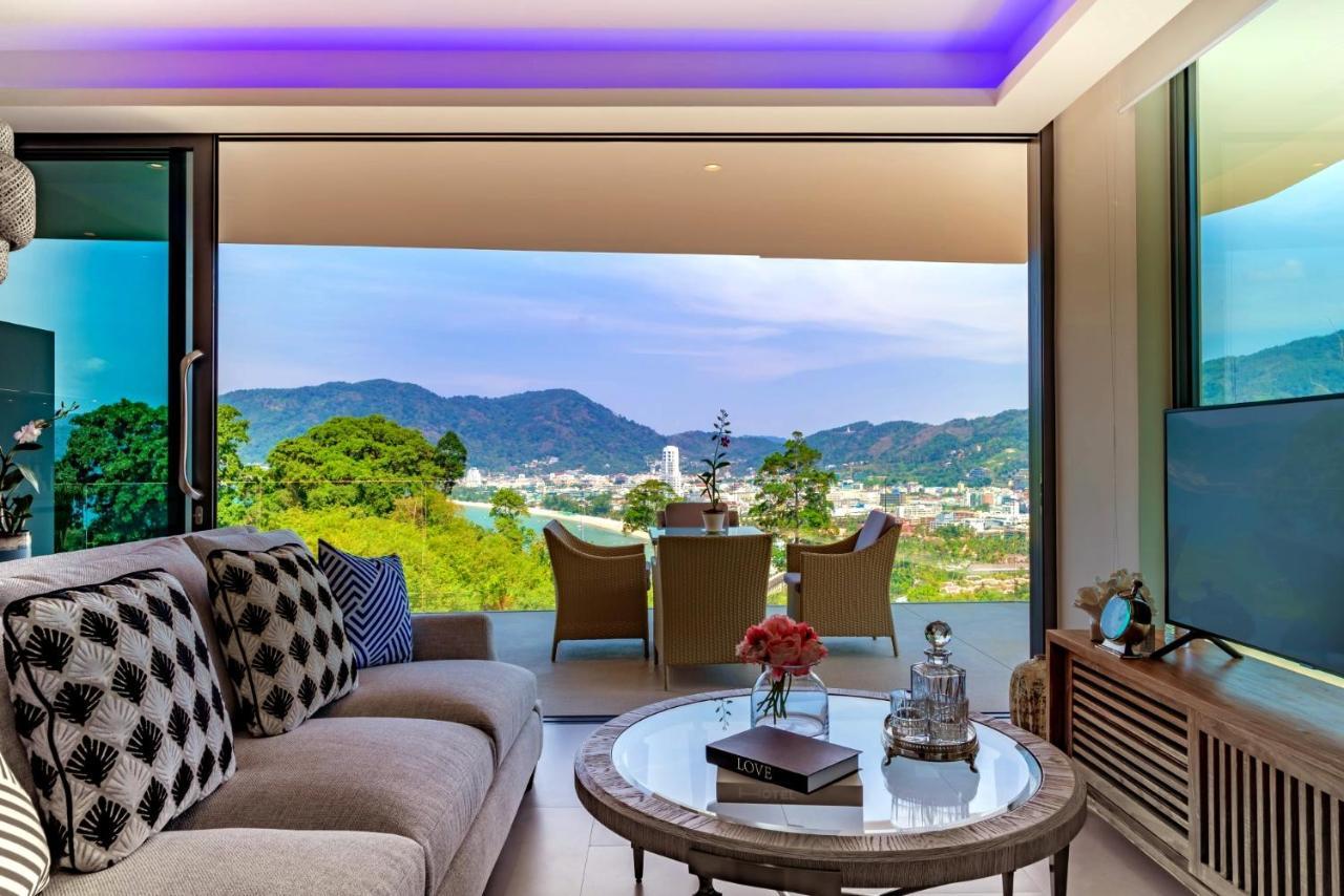 Patong Heights Hotel Exterior photo Living room with a view of the city